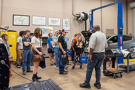 Students listen to an auto repair instructor at GTCC's Center for Advanced Manufacturing.